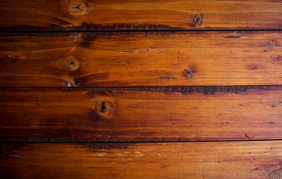 Close-up of a warm reddish-brown hardwood floor